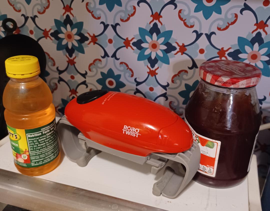 A battery operated jar opener for disabled individuals that opens  1.2 to 3.5 inches diameter lids. pic of jar opener